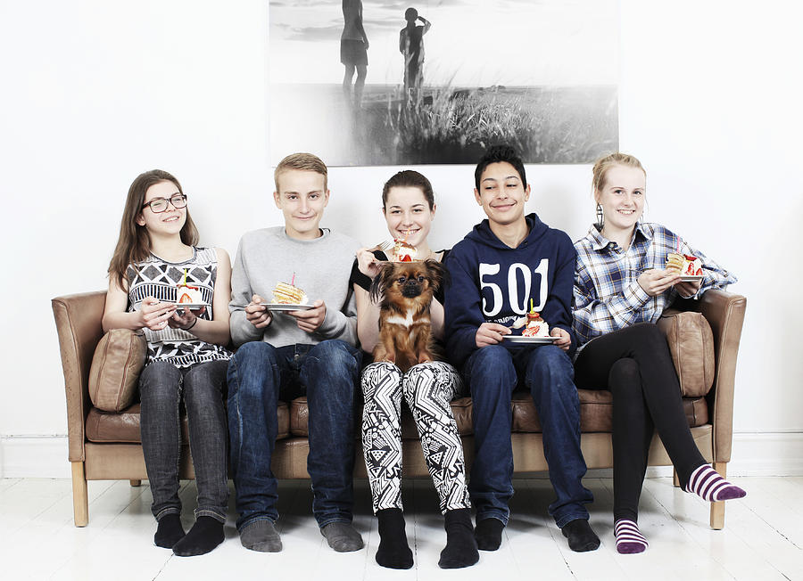 5 Teenager With Cake On Sofa Photograph by Muriel de Seze