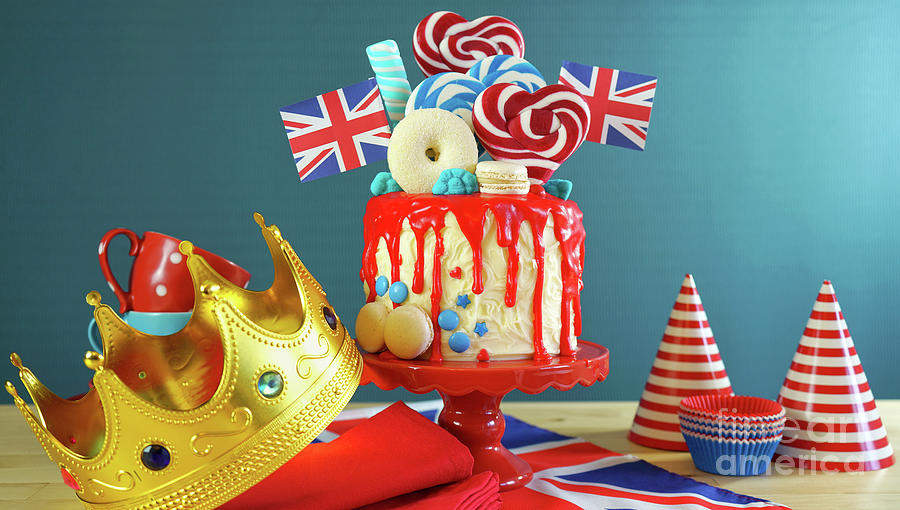 UK candyland drip cake with red white and blue decorations, lollipops and flags. #5 Photograph by Milleflore Images