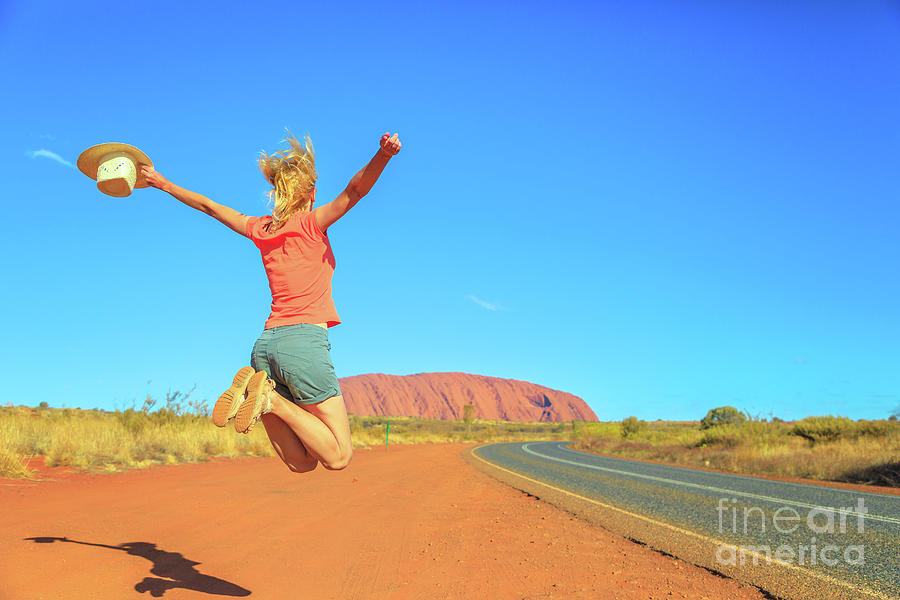 Uluru woman jumping #5 Photograph by Benny Marty