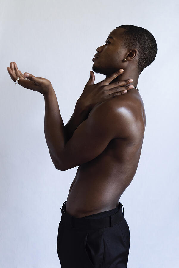 Young adult man with dark skin studio portrait. #5 Photograph by Martinedoucet