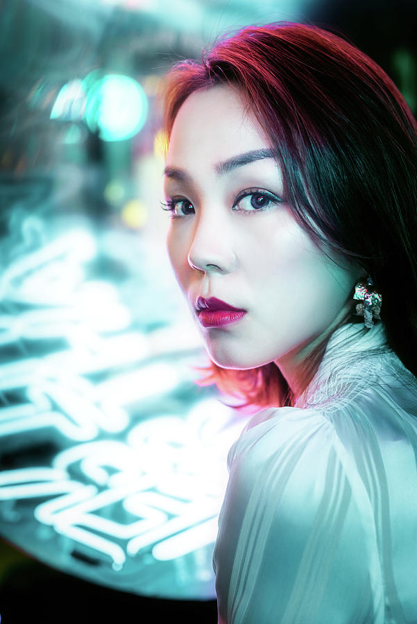 Young Chinese woman portrait with neon lights #5 Photograph by Philippe Lejeanvre