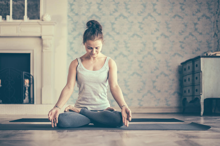 Young Woman Doing Yoga Meditation Exercise. Lotus Position #5 Photograph by Da-kuk