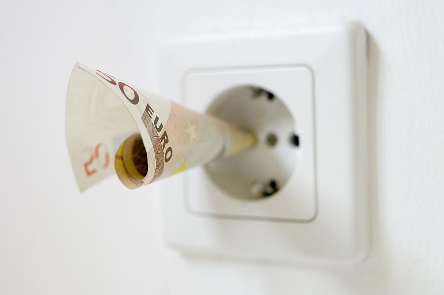 50 Euro Note Kept Into Electrical Socket, Close Up Photograph by Westend61