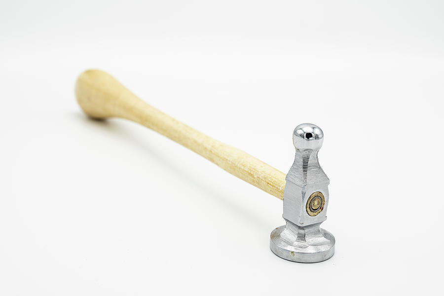 A chasing hammer lying on a white background #6 Photograph by
