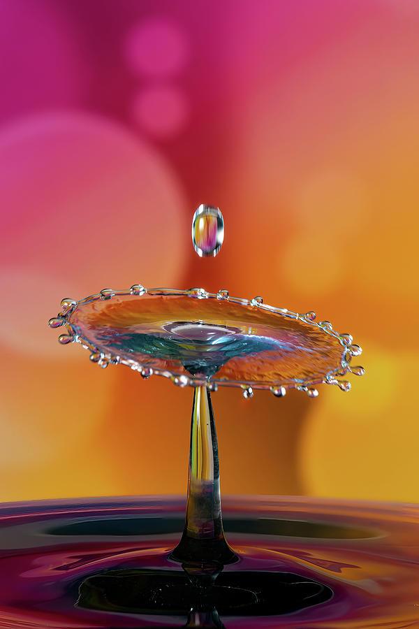 Abstract water droplet collisions on a bokeh background Photograph by ...