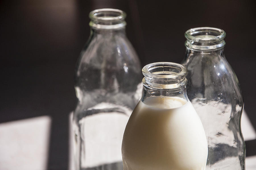 Botellas de vidrio con leche y vacías #6 Photograph by Javier Ghersi