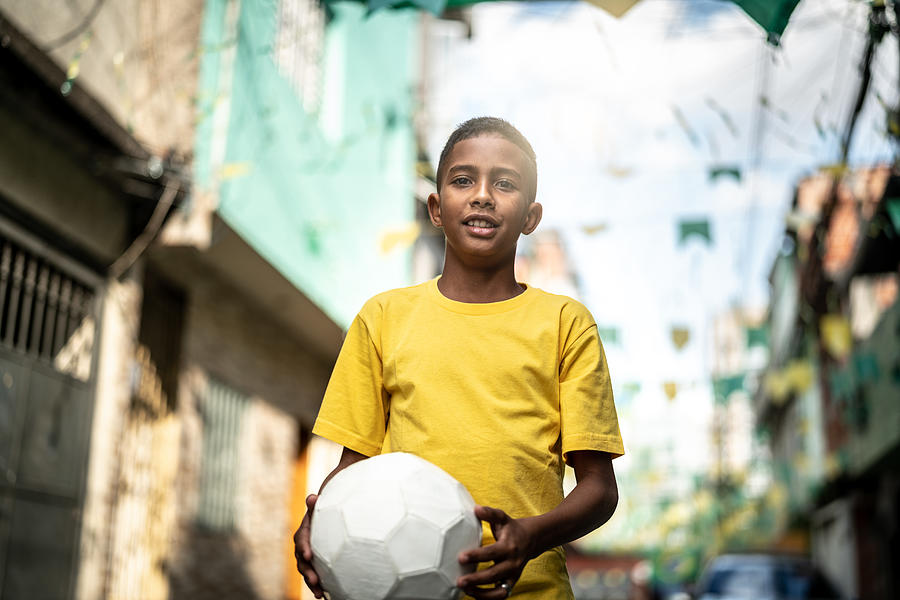 Brazilian Kid Playing Soccer Portrait #6 Photograph by FG Trade