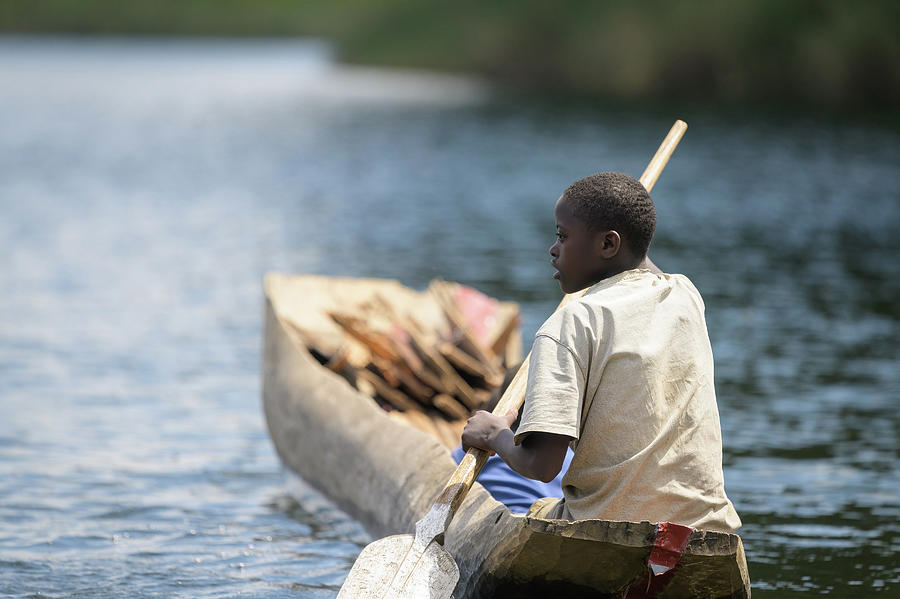 Children in a dugout canoe on Lake Bunyonyi Photograph by Stefan Rotter ...