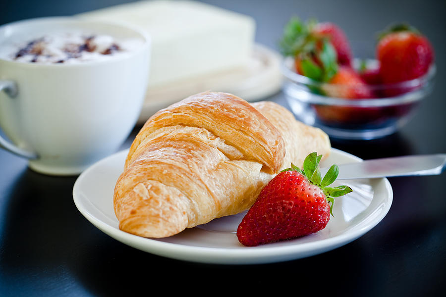 Continental breakfast with coffee and croissant #6 Photograph by Ola_p