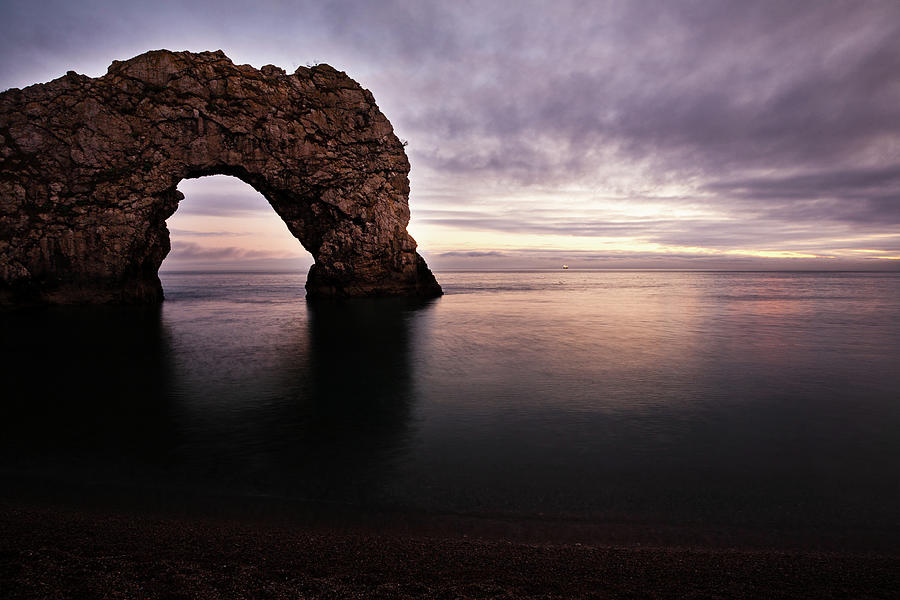 Durdle Door in the evening Photograph by Ian Middleton