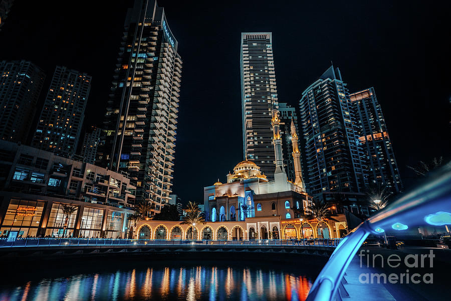 Fantastic nighttime skyline with illuminated skyscrapers. Dubai, UAE #6 Photograph by Raimond Klavins