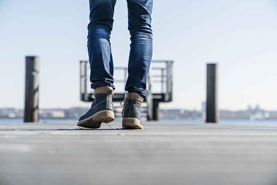 Low section of man walking on pier on sunny day in Germany. #6 Photograph by Tina Terras & Michael Walter