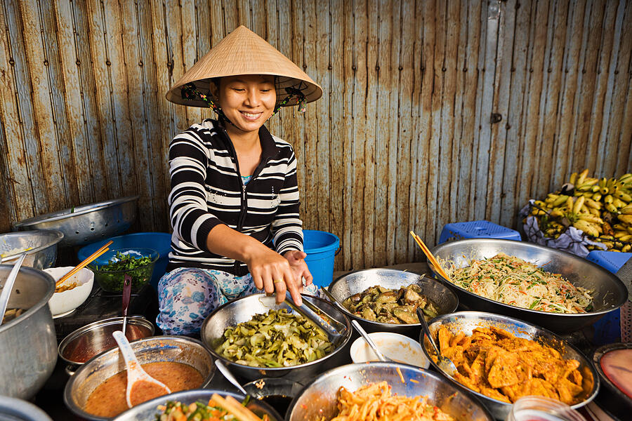 Vietnamese food vendor on local market #6 Photograph by Hadynyah