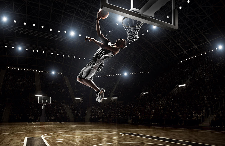 Basketball player makes slam dunk #7 Photograph by Dmytro Aksonov
