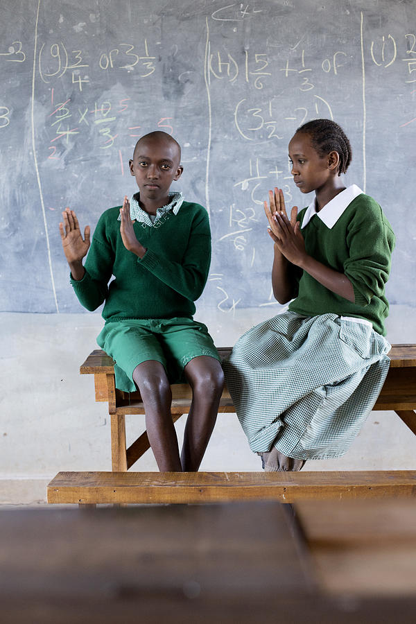 Deaf children learning sign language at school. #7 Photograph by Hugh Sitton