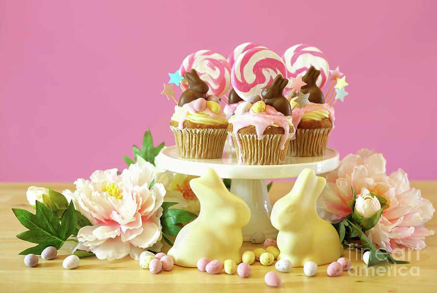 Easter theme candy land drip cupcakes in party table setting. #7 Photograph by Milleflore Images