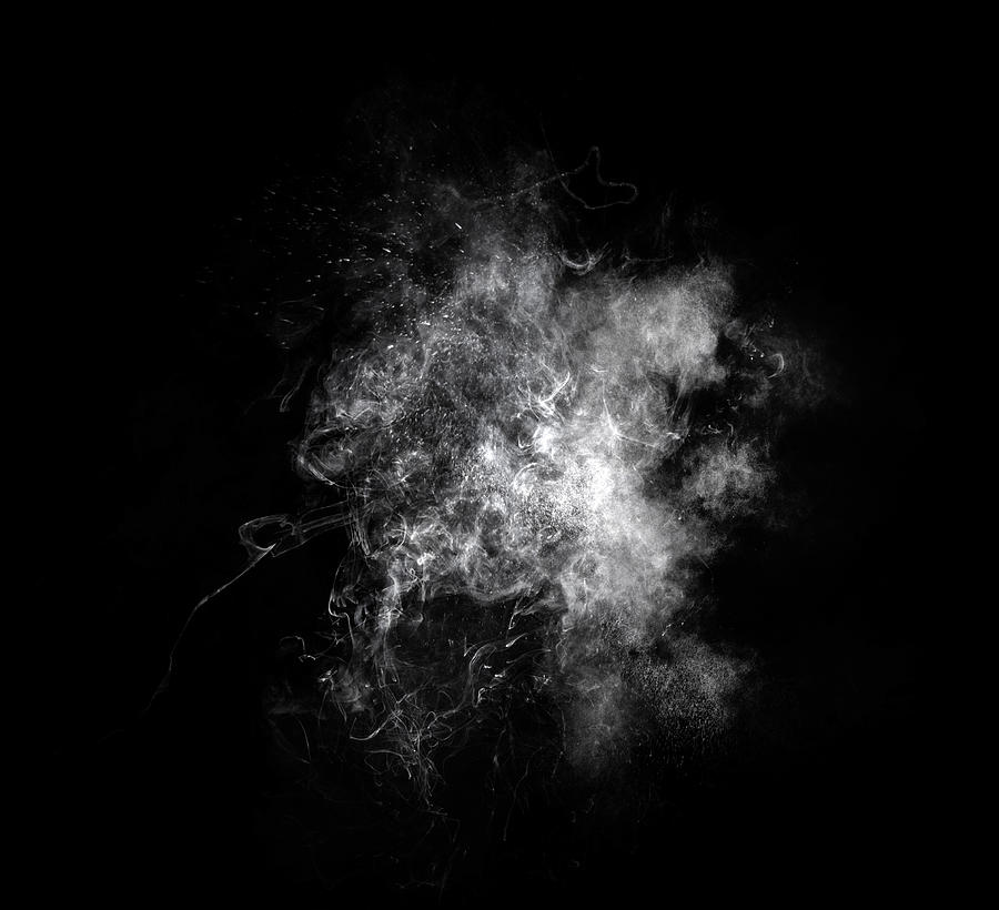 Explosion by an impact of a cloud of particles of powder of white color on a black background. #7 Photograph by Jose A. Bernat Bacete