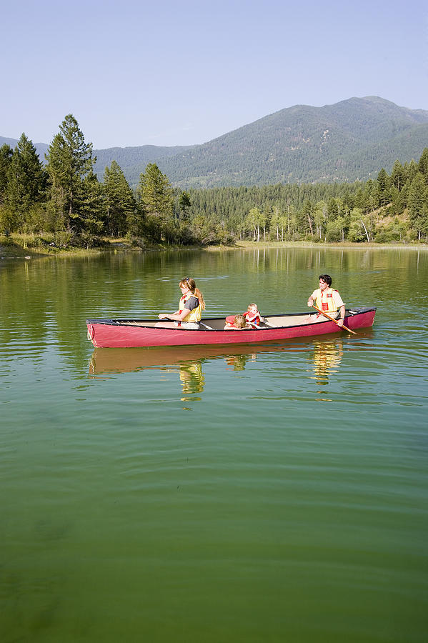 Family canoeing #7 Photograph by Comstock Images