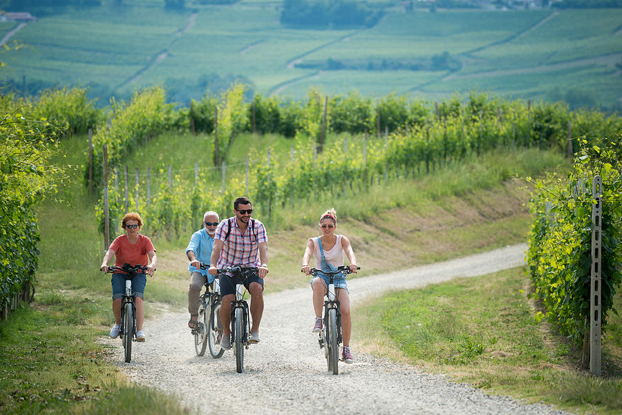 Family holidays in Langhe region, Piedmont, Italy: Electric bikes trip in the hills #7 Photograph by Ilbusca