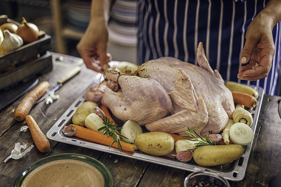 Preparing Stuffed Turkey for Holidays #7 Photograph by GMVozd