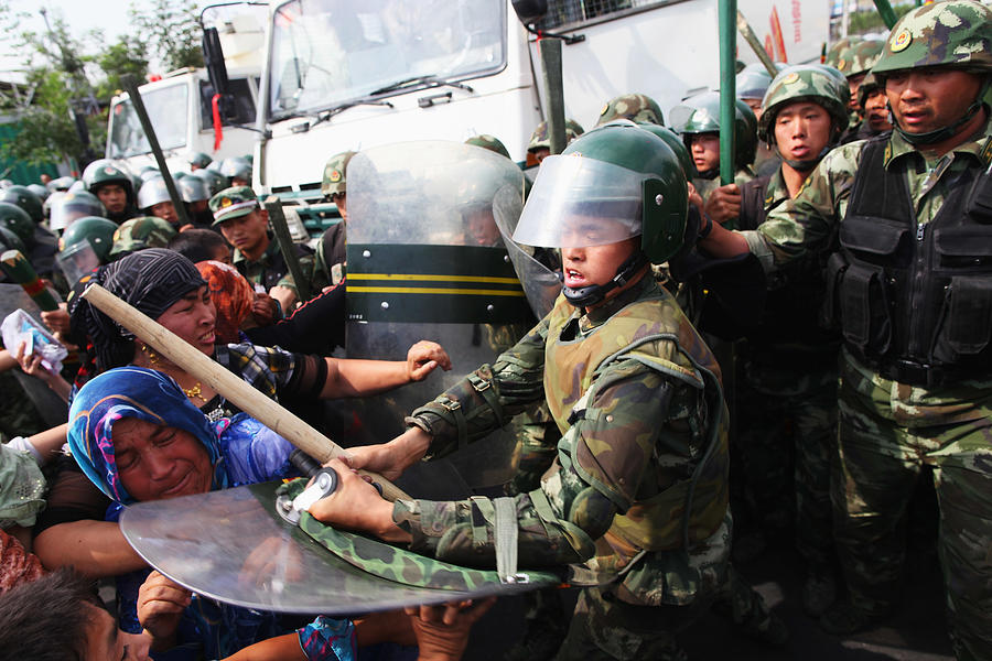 Riots Occur In Chinas Urumqi Ethnic Region Photograph by Guang Niu Riots Occur In Chinas Urumqi Ethnic Region Photograph by Guang Niu