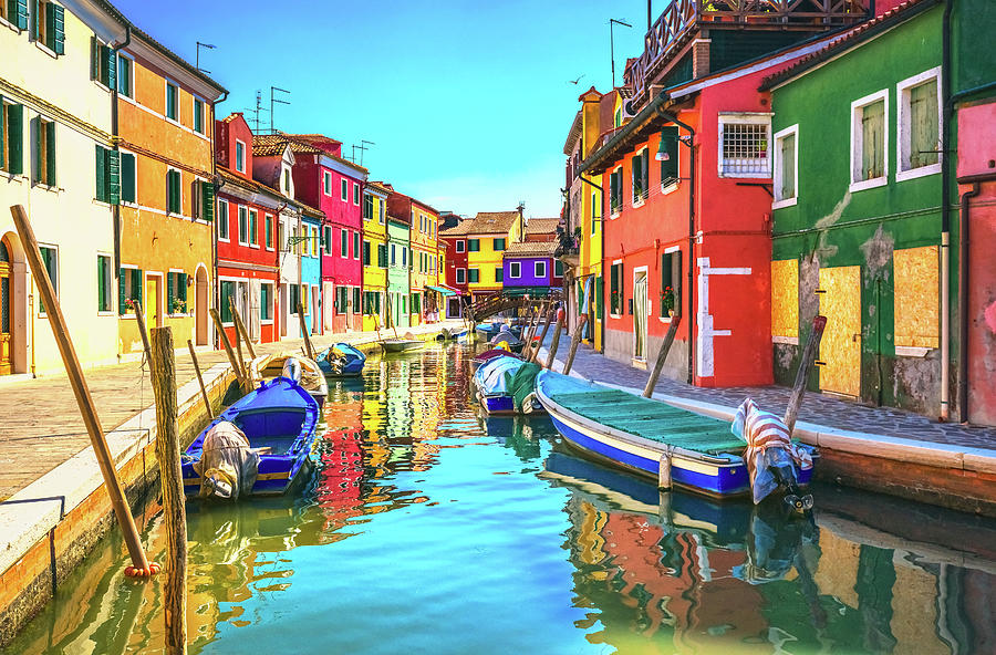 Venice landmark, Burano island canal, colorful houses and boats ...