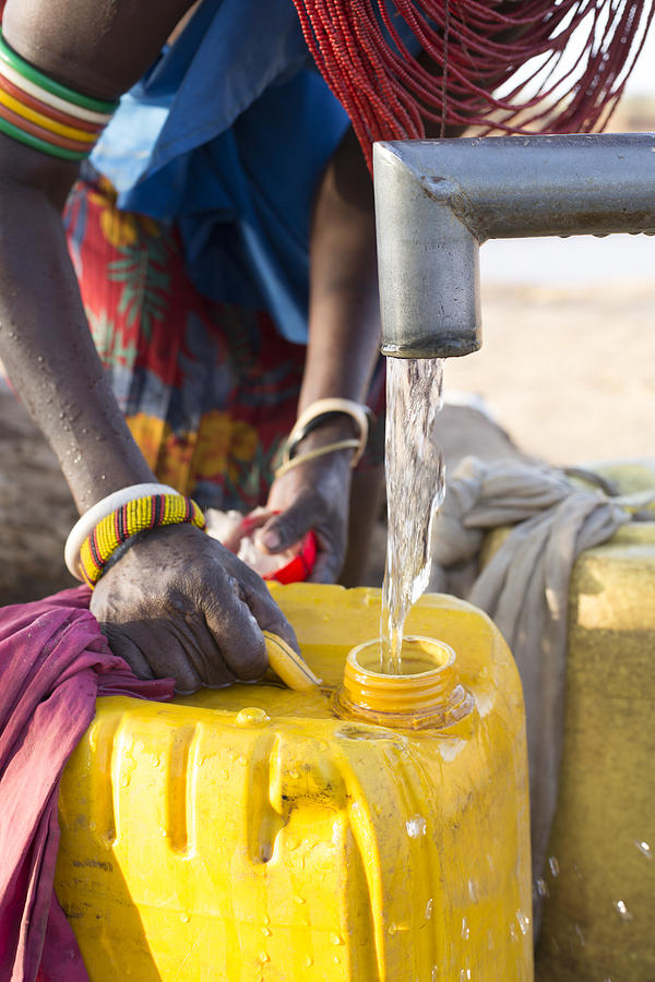 Women collecting clean water from borehole in desert. Samburu. Kenya. #7 Photograph by Hugh Sitton