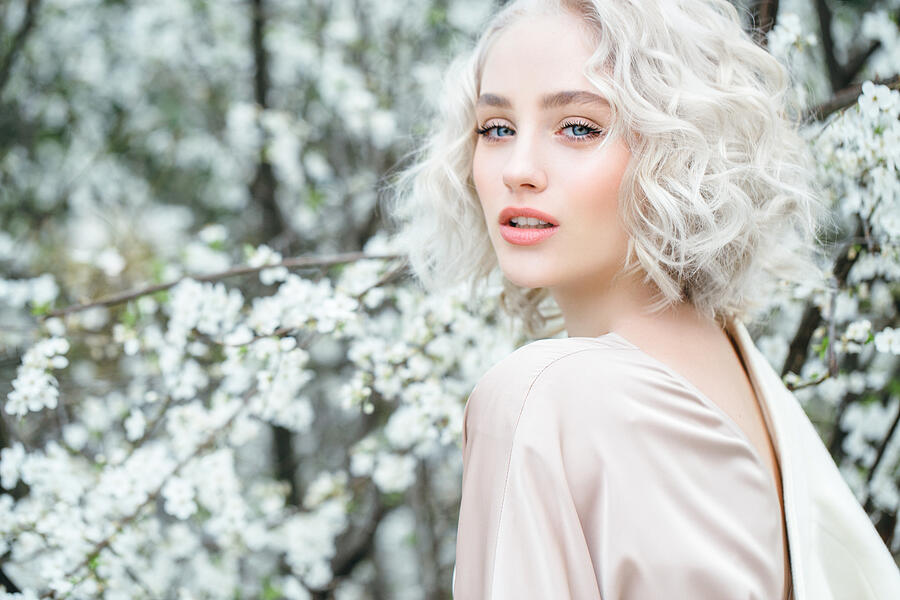 Beautiful girl on the background of spring bush #70 Photograph by CoffeeAndMilk