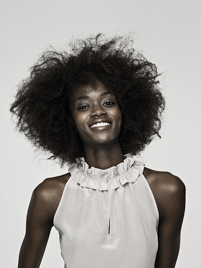 Beautiful young woman with an afro #8 Photograph by Image Source