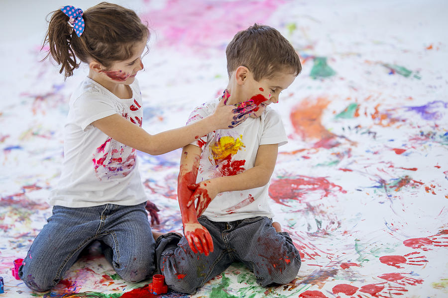 Fun Childhood Finger Painting Brother and Sister #8 Photograph by FatCamera