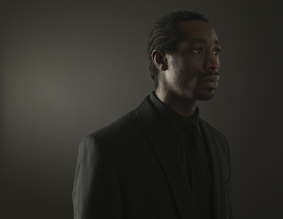 Portrait of a black man on a dark background #8 Photograph by Henrik Sorensen