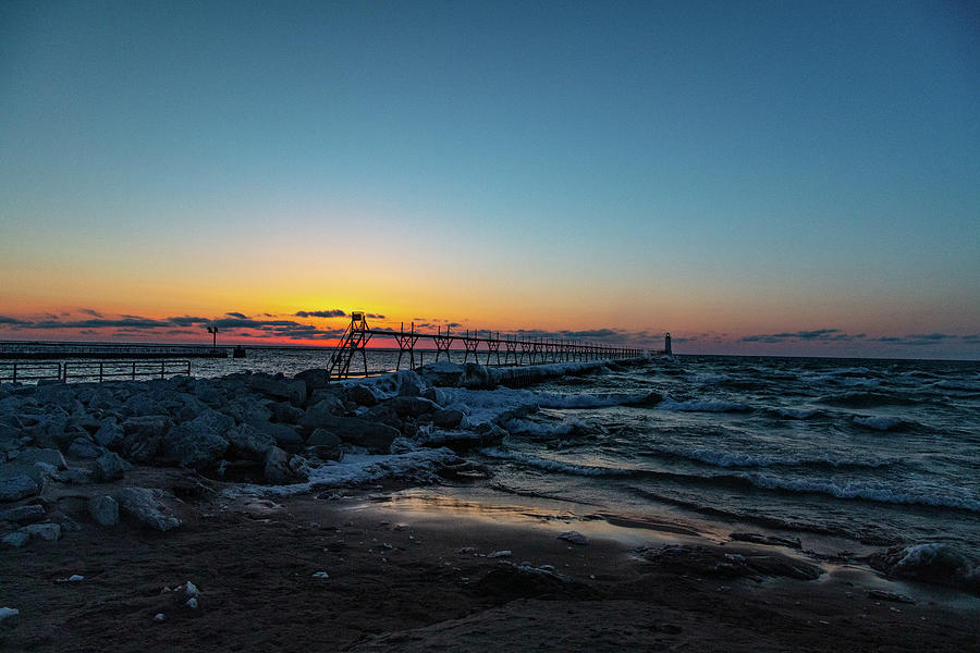 Sunset at Manistee Pier and Lighthouse in Manistee Michigan during the winter #8 Photograph by Eldon McGraw