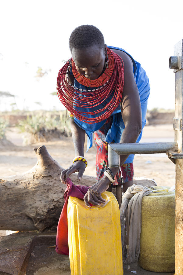 Women collecting clean water from borehole in desert. Samburu. Kenya. #8 Photograph by Hugh Sitton