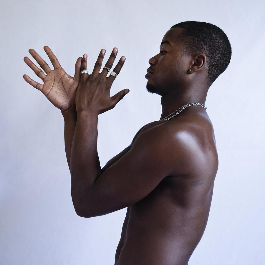 Young adult man with dark skin studio portrait. #8 Photograph by Martinedoucet