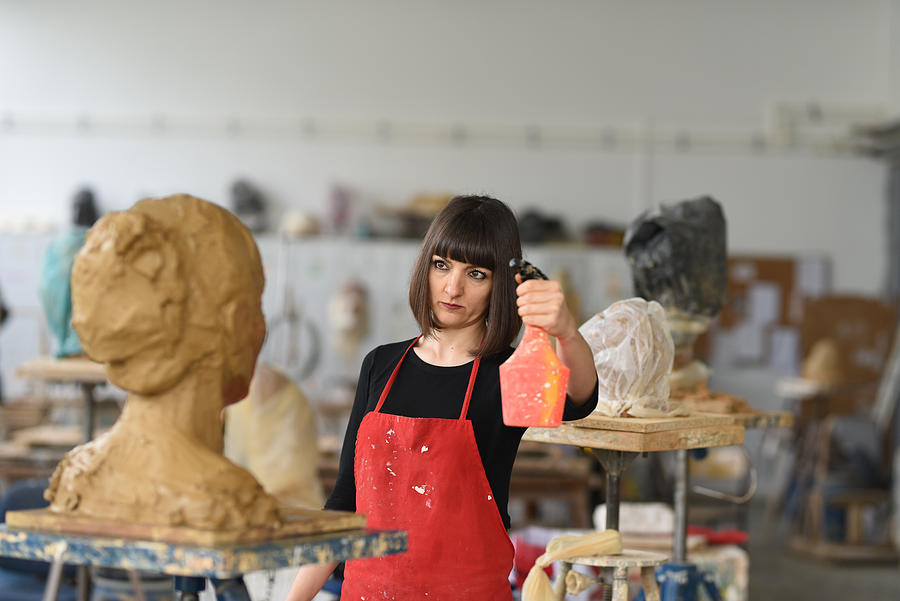 Young Female Sculptor is working in her studio #8 Photograph by Baranozdemir