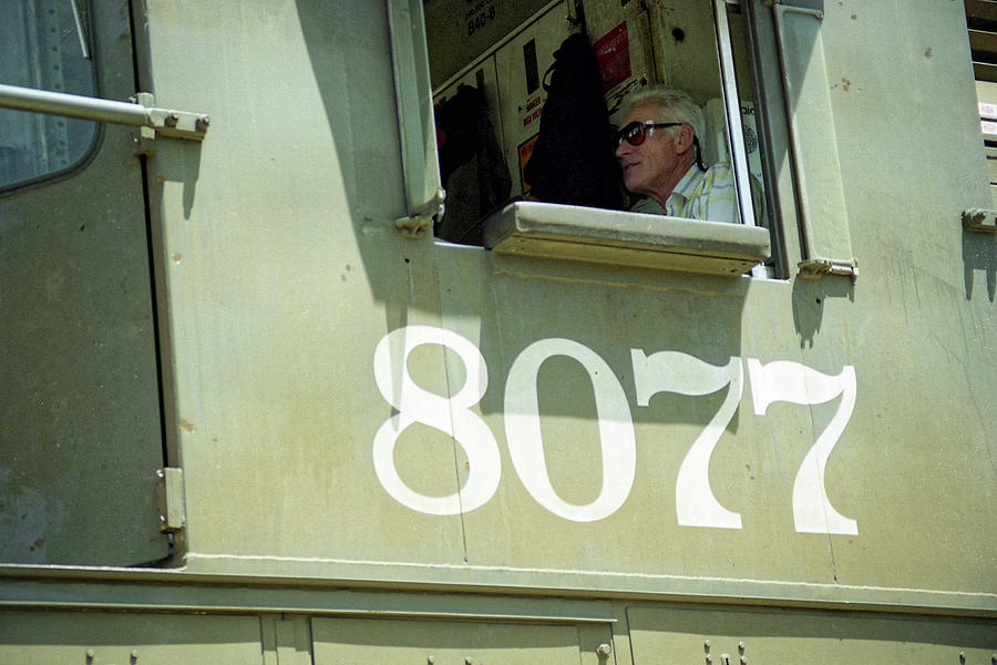 8077 -- Railroad Conductor in a GE B40-8 in San Luis Obispo, California Photograph by Darin Volpe
