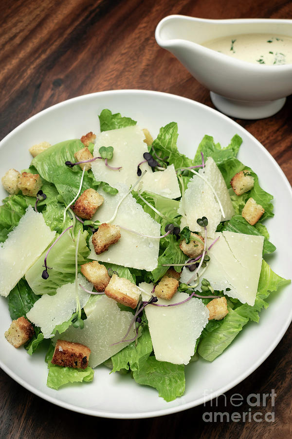 Caesar Salad With Parmesan Cheese And Croutons On Table Photograph