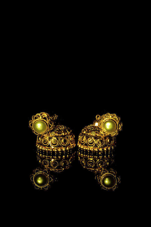 Earring Gold Jewelry Traditional With Stones And Two Golden Earrings With Reflection Pair Of Golden Earring With Pearl Tone On Black Background Luxury Female Jewelry Close Up Jewelry By Srinivasan Jayaprakash