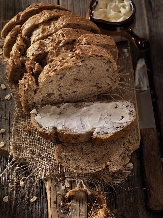 9 Grain Artisan Bread Loaf with Butter Photograph by Lauri Patterson
