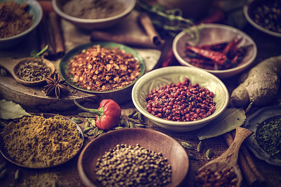 Spices and Herbs on Wooden Background #9 Photograph by GMVozd