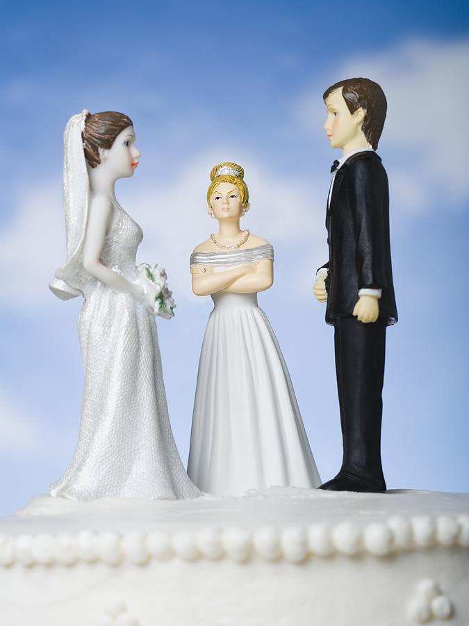 Wedding cake visual metaphor with figurine cake toppers #9 Photograph by Rubberball/Mike Kemp