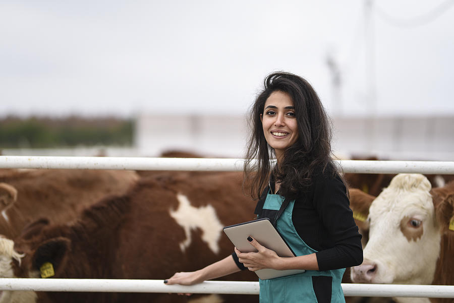 Young female farmer using a digital tablet #9 Photograph by Baranozdemir