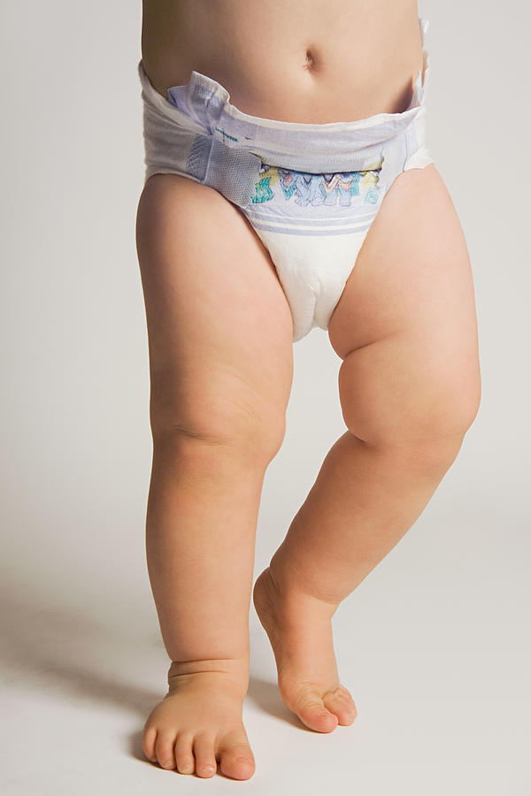 A baby wearing a nappy Photograph by Image Source