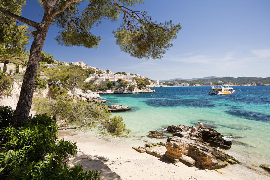 A beach at Cala Fornells Photograph by Jorg Greuel