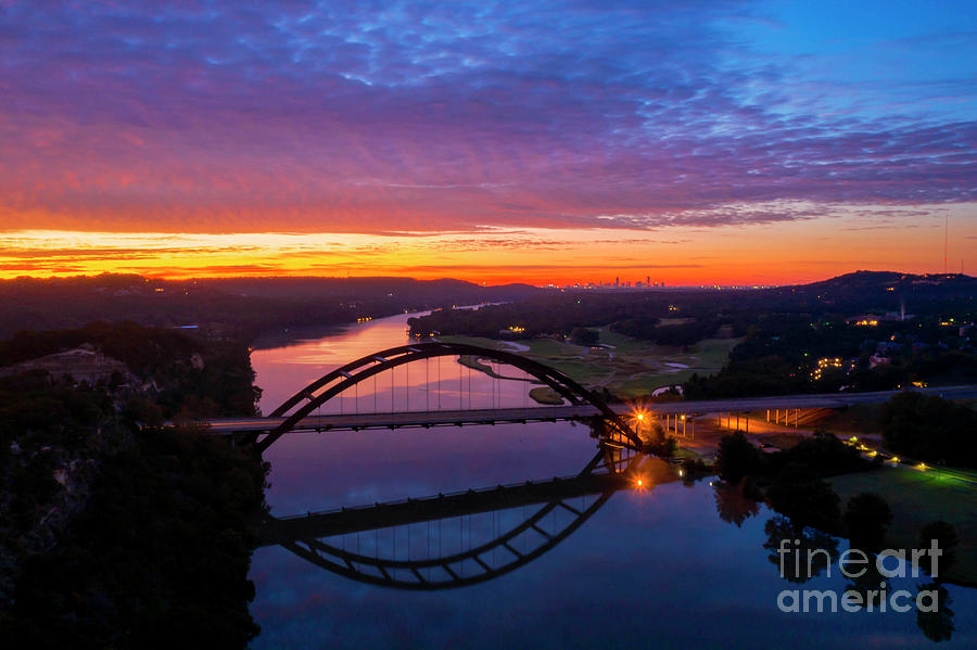 Austin Photograph - A beautiful colorful sunrise shines over the 360 Pennybacker Bri by Dan Herron