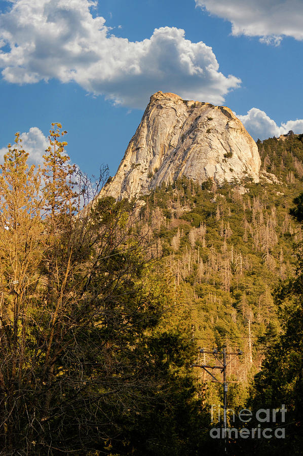 A beautiful granite faced mountain top with sheer cliff and stunning landscape. Photograph by Gunther Allen