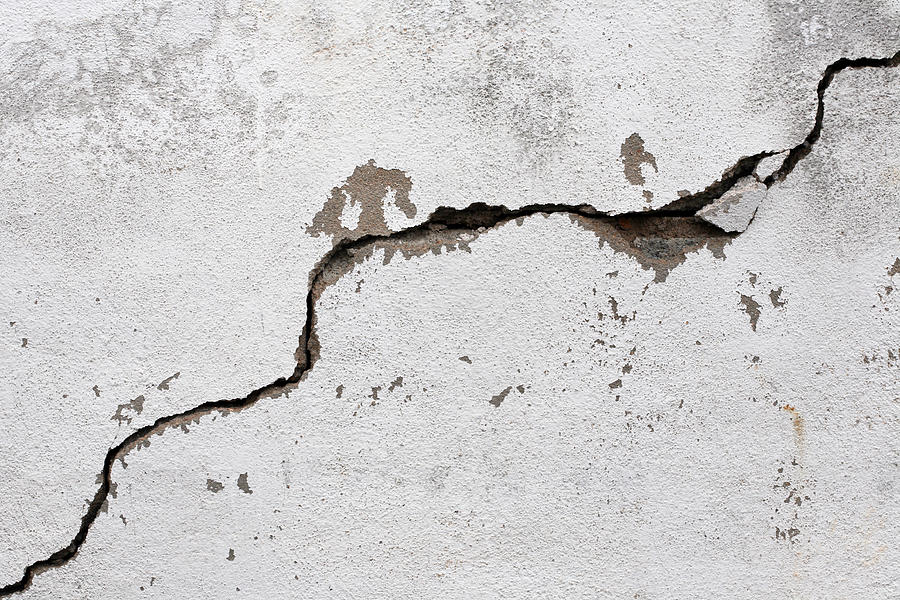 A big crack on an old, rotten wall Photograph by Menonsstocks
