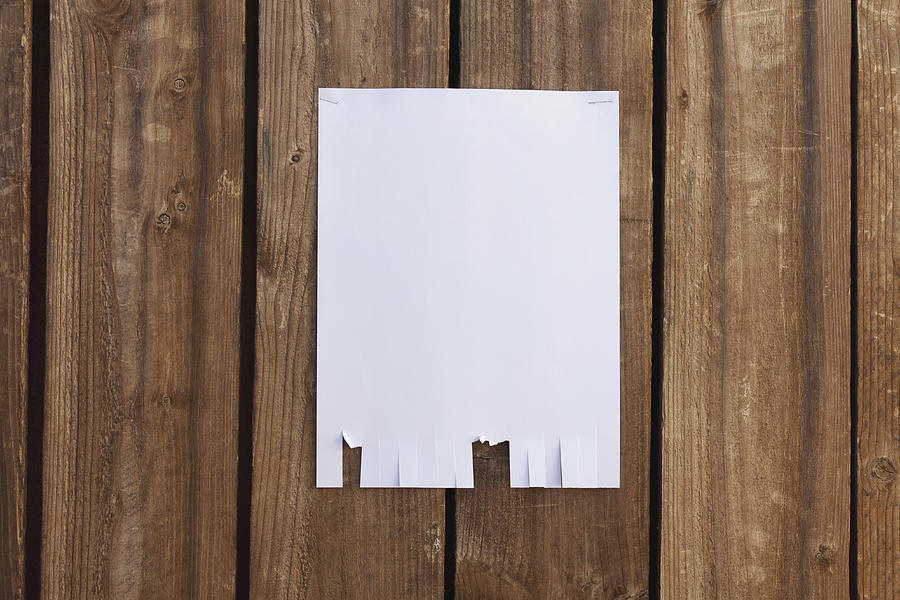 A blank flyer hanging on a wooden fence Photograph by Patrick Strattner