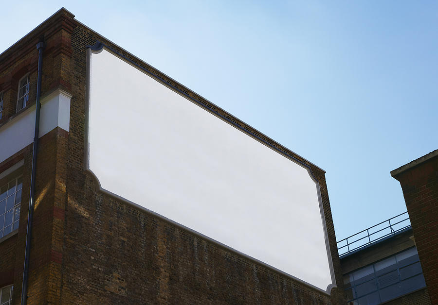 A blank old fashioned bill board on the side of a Photograph by Ben Richardson