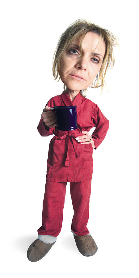 A Blonde Caucasian Woman Wearing Slippers And Red Pajamas With A Red Robe Holds Her Mug And Looks Very Sleepy And People Photograph by Photodisc